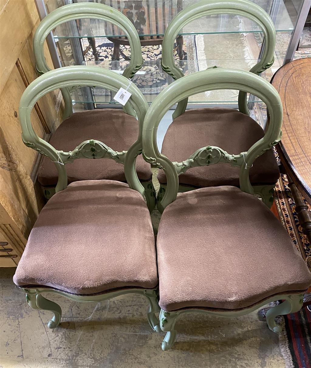 A set of four painted Victorian dining chairs and an oval centre table